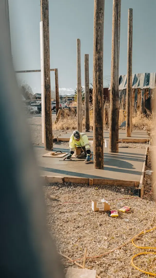 Construction worker building a wood-framed structure